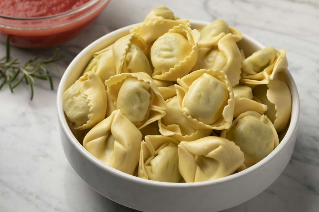Bowl with traditional fresh Italian tortellini stuffed with Ricotta and Spinach