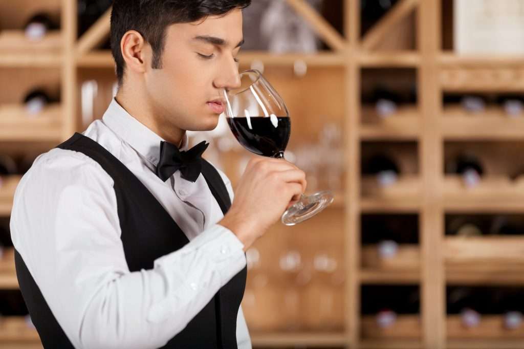 Tasting wine.